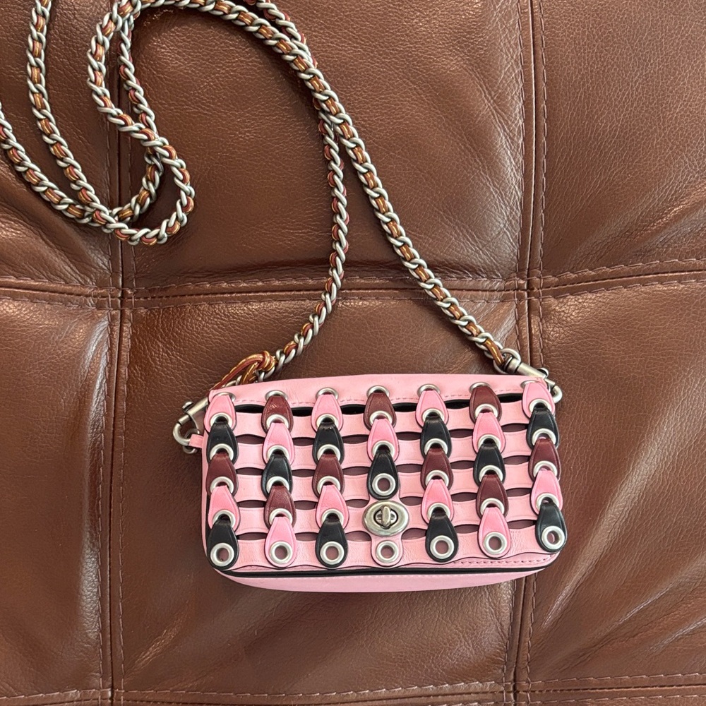 Pink mini coach bag.